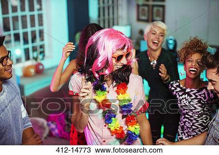 Friends dancing together at party View Large Photo Image Stock Image - Friends dancing together at party. Fotosearch