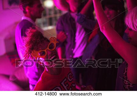 Friends dancing together at party View Large Photo Image Stock Image - Friends dancing together at party. Fotosearch