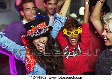 Friends dancing together at party View Large Photo Image Stock Image - Friends dancing together at party. Fotosearch