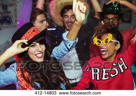 Friends dancing together at party View Large Photo Image Stock Image - Friends dancing together at party. Fotosearch