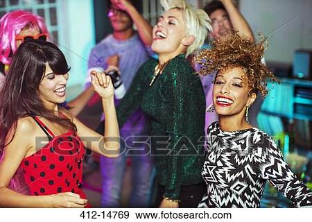 Friends dancing together at party View Large Photo Image Stock Photo - Friends dancing together at party. Fotosearch