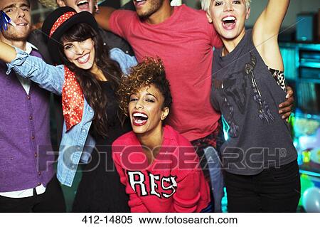 Friends dancing together at party View Large Photo Image Stock Photography - Friends dancing together at party. Fotosearch