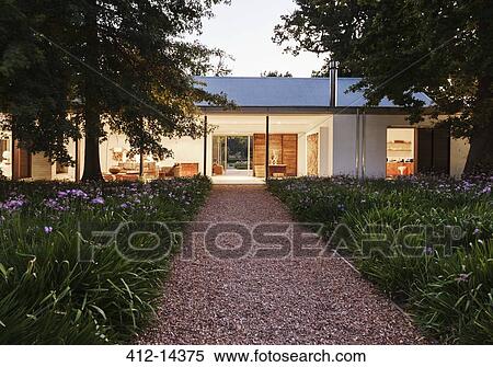 Gravel walkway leading to modern house View Large Photo Image Stock Photography - Gravel walkway leading to modern house. Fotosearch