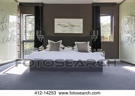 Lamps and wall art in modern bedroom View Large Photo Image Stock Image - Lamps and wall art in modern bedroom. Fotosearch
