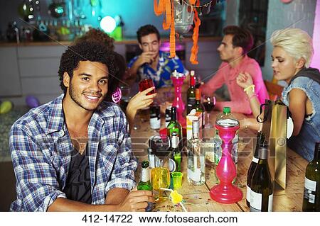Man smiling at party View Large Photo Image Stock Image - Man smiling at party. Fotosearch
