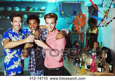 Men toasting each other at party View Large Photo Image Stock Image - Men toasting each other at party. Fotosearch