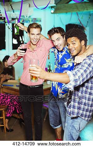 Stock Photo - Men toasting each other at party. Fotosearch