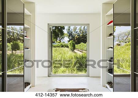 Mirrored closets framing window with view of vineyards View Large Photo Image Stock Photo - Mirrored closets framing window with view of vineyards. Fotosearch