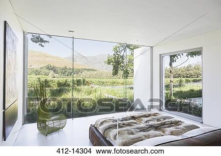 Picture - Modern bedroom overlooking rural landscape. Fotosearch