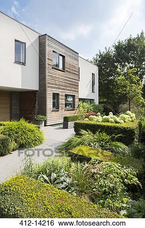 Modern house and landscaped garden View Large Photo Image Stock Photograph - Modern house and landscaped garden. Fotosearch