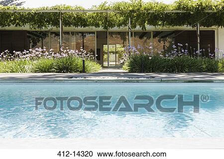Modern house and swimming pool View Large Photo Image Stock Image - Modern house and swimming pool. Fotosearch