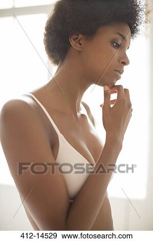 Pensive woman wearing bra View Large Photo Image Stock Photo - Pensive woman wearing bra. Fotosearch