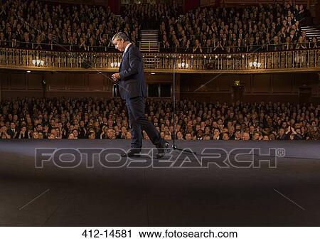 Performer walking of stage in theater View Large Photo Image Stock Image - Performer walking of stage in theater. Fotosearch