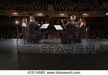 Quartet performing on stage in theater View Large Photo Image Stock Image - Quartet performing on stage in theater. Fotosearch