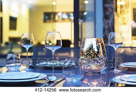 Stock Photograph - Set table in backyard at dusk. Fotosearch