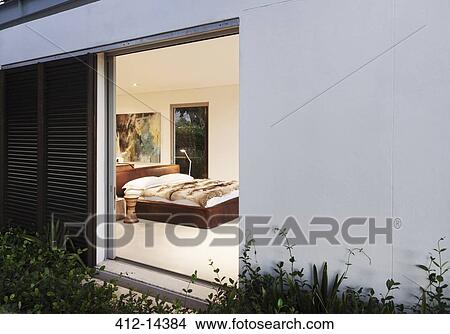 Picture - Sliding door open to modern bedroom. Fotosearch