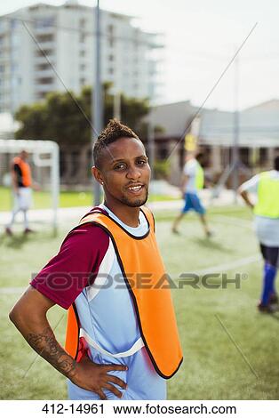 Soccer player smiling on field View Large Photo Image Stock Image - Soccer player smiling on field. Fotosearch