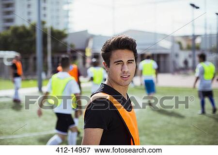 Soccer player smiling on field View Large Photo Image Stock Photo - Soccer player smiling on field. Fotosearch