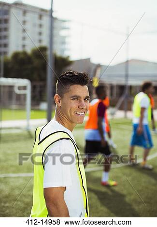 Soccer player smiling on field View Large Photo Image Stock Photo - Soccer player smiling on field. Fotosearch