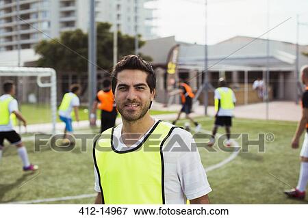 Soccer player smiling on field View Large Photo Image Stock Photo - Soccer player smiling on field. Fotosearch