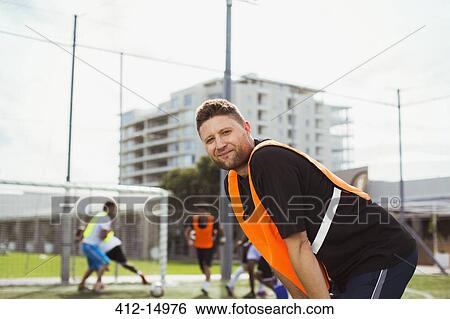 Soccer player smiling on field View Large Photo Image Stock Photograph - Soccer player smiling on field. Fotosearch