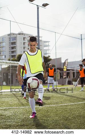 Soccer player training on field View Large Photo Image Stock Image - Soccer player training on field. Fotosearch