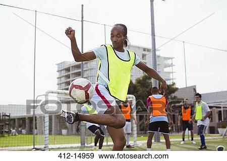 Soccer player training on field View Large Photo Image Stock Photo - Soccer player training on field. Fotosearch