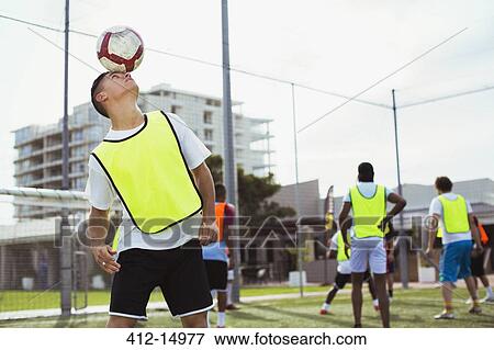 Soccer player training on field View Large Photo Image Stock Photo - Soccer player training on field. Fotosearch