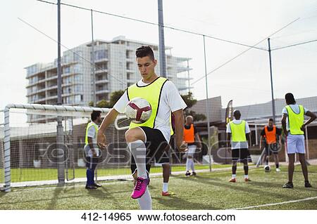 Stock Photography - Soccer player training on field. Fotosearch