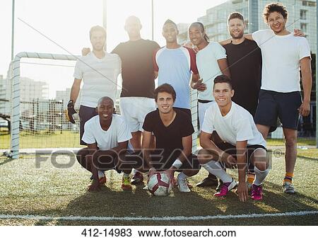 Soccer players smiling on field View Large Photo Image Stock Image - Soccer players smiling on field. Fotosearch