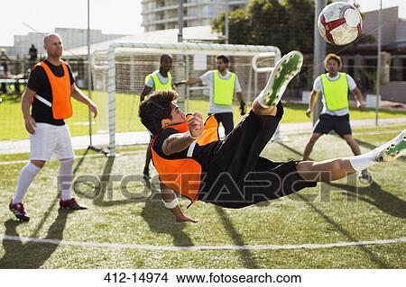 Picture - Soccer players training on field. Fotosearch