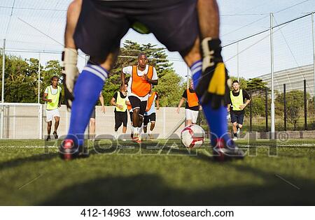 Soccer players training on field View Large Photo Image Stock Image - Soccer players training on field. Fotosearch