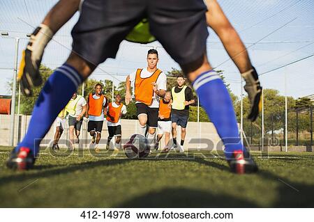 Soccer players training on field View Large Photo Image Stock Photo - Soccer players training on field. Fotosearch