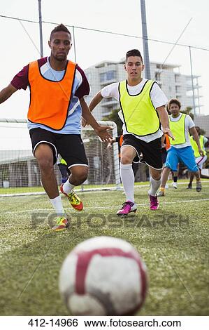 Soccer players training on field View Large Photo Image Stock Photograph - Soccer players training on field. Fotosearch