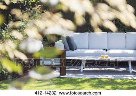 Sofa and armchair in backyard View Large Photo Image Stock Image - Sofa and armchair in backyard. Fotosearch