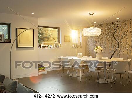 Stock Image - Sun shining through window of retro dining room. Fotosearch