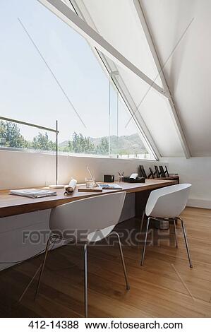 Stock Photo - Table at window in modern office. Fotosearch