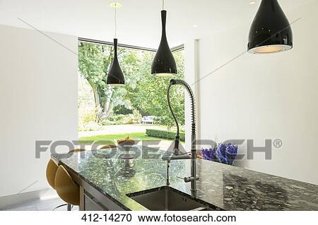 View of backyard beyond modern kitchen View Large Photo Image Stock Image - View of backyard beyond modern kitchen. Fotosearch