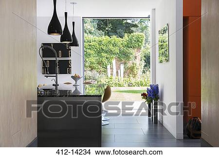 View of garden through modern kitchen window View Large Photo Image Picture - View of garden through modern kitchen window. Fotosearch