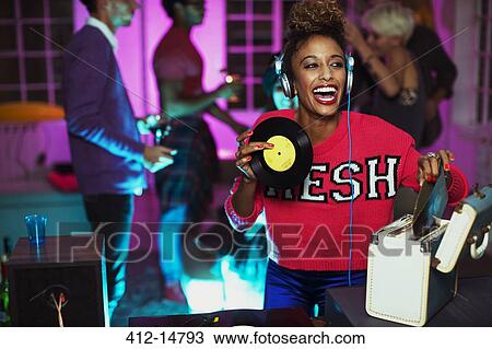 Woman playing records at party View Large Photo Image Stock Image - Woman playing records at party. Fotosearch