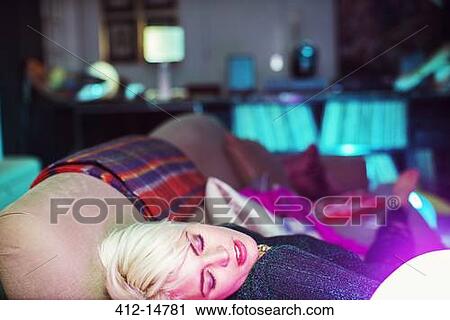 Woman sleeping on sofa after party View Large Photo Image Stock Image - Woman sleeping on sofa after party. Fotosearch