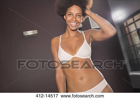 Woman wearing bra and panties in bedroom View Large Photo Image Stock Photo - Woman wearing bra and panties in bedroom. Fotosearch