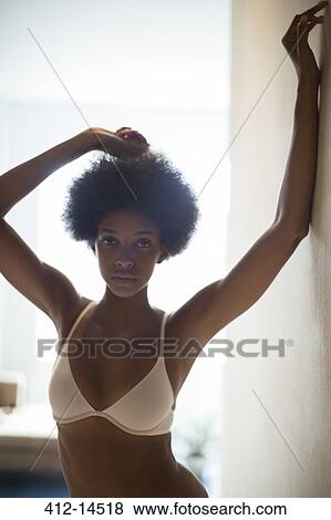 Woman wearing bra in corridor View Large Photo Image Stock Photo - Woman wearing bra in corridor. Fotosearch