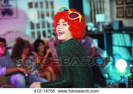 Stock Photography - Woman wearing wig and oversized sunglasses. Fotosearch