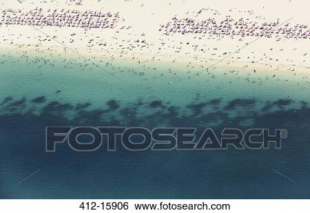 Aerial view of crowd on beach View Large Photo Image Stock Photograph - Aerial view of crowd on beach. Fotosearch
