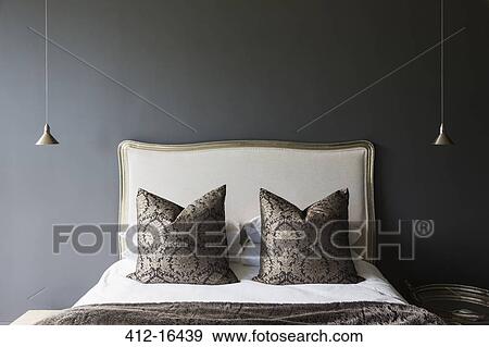 Stock Photo - Bed in luxury bedroom. Fotosearch