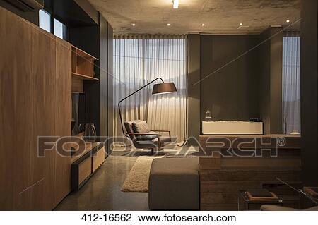 Stock Image - Chair and floor lamp in corner of modern living room. Fotosearch