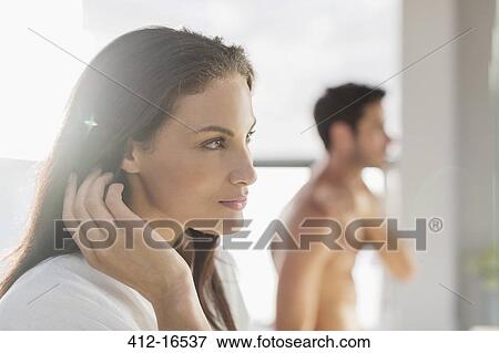 Stock Photo - Close up of woman with hand in hair. Fotosearch