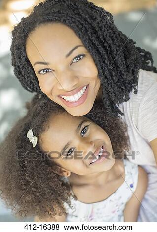 Close up portrait of happy mother and daughter View Large Photo Image Stock Photo - Close up portrait of happy mother and daughter. Fotosearch