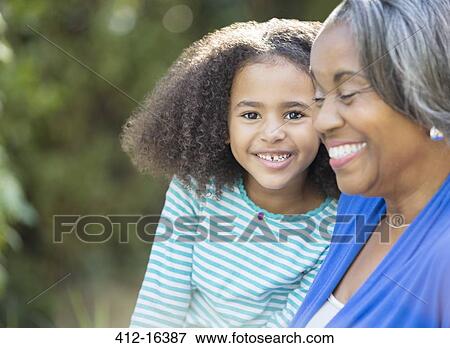 Close up portrait of happy granddaughter with grandmother View Large Photo Image Stock Photo - Close up portrait of happy granddaughter with grandmother. Fotosearch